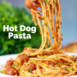 Hot dog pasta with a mustard and crispy onion crumb being eaten with a fork featuring a title overlay.