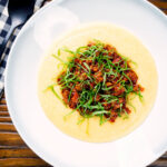 Overhead sausage ragu made with Italian sausages and tomatoes served with polenta.