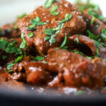 Overhead close-up kaleji masala or Indian lambs liver curry.
