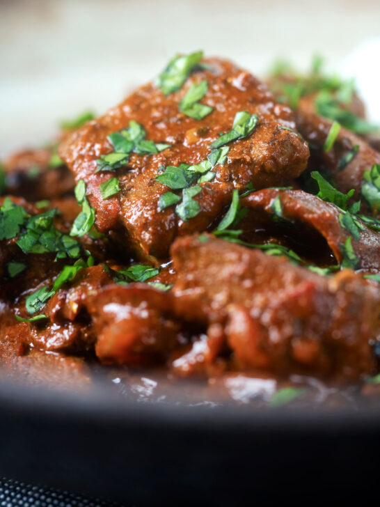 Overhead close-up kaleji masala or Indian lambs liver curry.