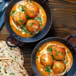 Overhead malai kofta, vegetarian paneer and potato "meatball" curry.