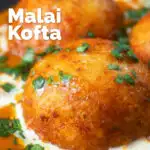 Close-up malai kofta, vegetarian paneer and potato "meatball" curry featuring a title overlay.