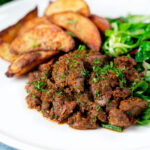 Peri peri chicken livers served with beetroot salad and wedges.