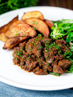 Peri peri chicken livers served with beetroot salad and wedges.