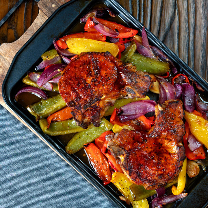 Pork chop traybake with sweet peppers and onions in red wine vinegar.