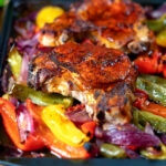 Pork chop traybake with peppers and onions cooked in red wine vinegar and honey.