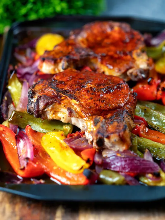 Pork chop traybake with peppers and onions cooked in red wine vinegar and honey.