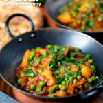 Indian aloo matar curry with potatoes and peas served with naan bread featuring a title overlay.