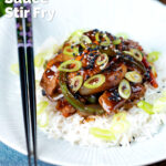 Chinese takeaway style beef in black bean sauce with green peppers featuring a title overlay.