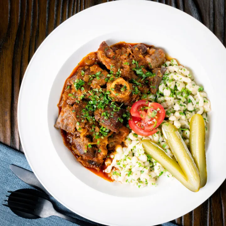 Birkapörkölt or Hungarian Mutton Stew served with nokedli and pickles.