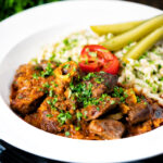 Hungarian birkapörkölt or mutton stew served with nokedli.