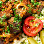 Close-up overhead mutton stew or birkapörkölt in Hungarian, served with nokedli.