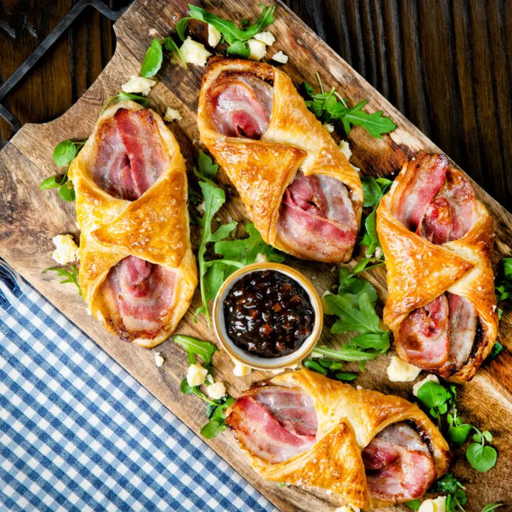 Cheddar cheese and bacon turnovers with Branston pickle in golden puff pastry.