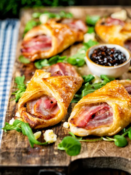 Cheddar cheese and streaky bacon turnovers with Branston pickle.