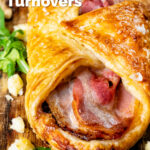 Close up cheddar cheese and bacon turnovers with Branston pickle featuring a title overlay.