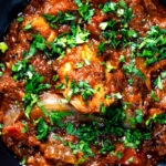 Overhead close-up Anglo Indian chicken dopiaza curry.