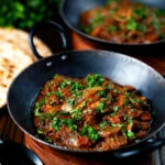Anglo Indian chicken dopiaza curry served with chapatis.