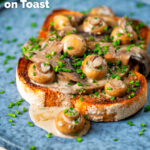 Creamy garlic mushrooms on toast with portobello and button mushrooms and snipped chives featuring a title overlay.