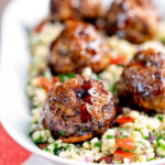 Harissa beef meatballs served with bulgur wheat.