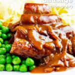 Cooked Cumberland sausage ring with onion gravy, peas and mash featuring a title overlay.
