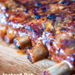 Close-up apple and honey glazed pressure cooker pork ribs featuring a title overlay.