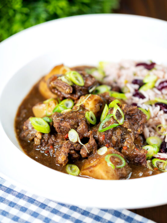 Jamaican curry goat served with rice and peas.