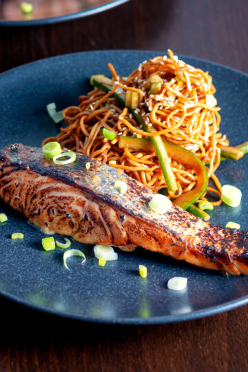 Korean yang nyum inspired grilled salmon fillet served with noodles.