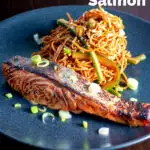 Korean yang nyum inspired grilled salmon fillet served with noodles featuring a title overlay.