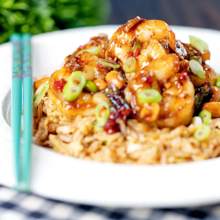 Chinese takeaway style kung po or pao prawns with peanuts served with egg fried rice.