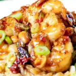 Close-up kung po king prawns with peanuts and egg fried rice featuring a title overlay.