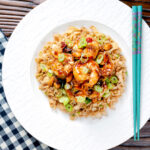 Overhead kung po king prawns with peanuts and egg fried rice.
