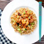 Overhead kung po king prawns with peanuts and egg fried rice.
