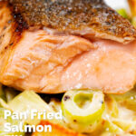 Close up pan fried salmon with crispy skin showing internal flesh colour when cooked featuring a title overlay.