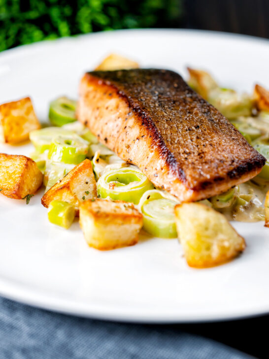 Pan fried salmon fillet with crispy skin served with creamed leeks and parmentier potatoes.