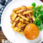 Overhead Chinese takeaway style salt and pepper chips served with a burger featuring a title overlay.