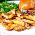 Chinese takeaway style salt and pepper chips served with a cheese burger.