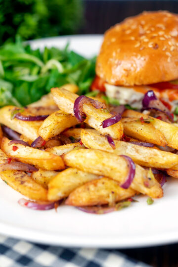 Chinese takeaway style salt and pepper chips served with a cheese burger.