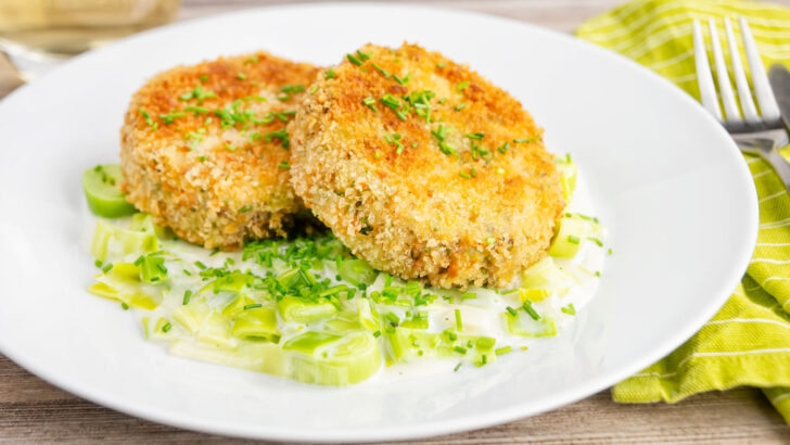 Fresh salmon and tinned sardine fish cakes served with creamed leeks.