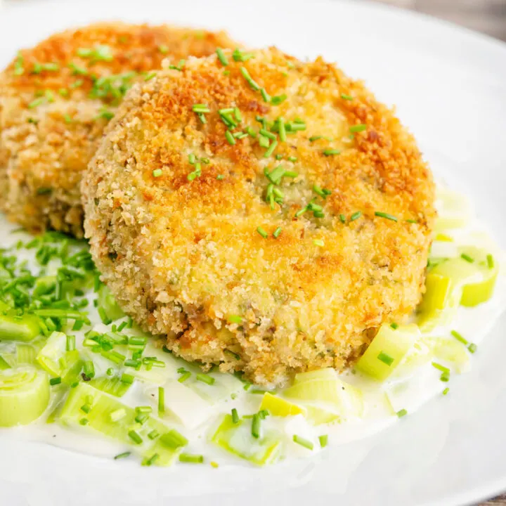 Fresh salmon and tinned sardine fish cakes served with creamed leeks.