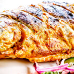 Close-up tandoori trout fish that has been cooked on a BBQ.
