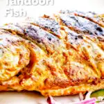 Close-up tandoori trout fish that has been cooked on a BBQ featuring a title overlay.