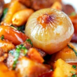 Close-up shallot in a Thai lamb massaman curry.