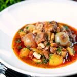 Slow-cooked Thai lamb massaman curry with potatoes, shallots and peanuts.