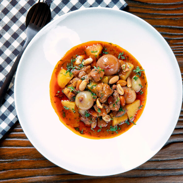 Thai lamb massaman curry with potatoes, shallots and peanuts.