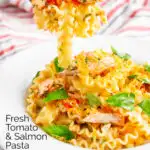 Tomato and salmon fillet pasta with basil and crispy bread crumbs on a fork featuring a title overlay.