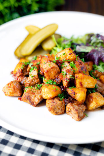 Hungarian Brassói aprópecsenye with crispy potatoes, bacon and pork tenderloin.