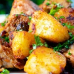Close-up crispy potatoes in a Hungarian Brassói aprópecsenye dish.