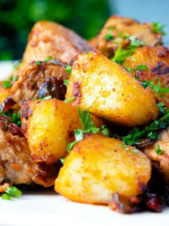 Close-up crispy potatoes in a Hungarian Brassói aprópecsenye dish.