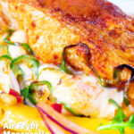 Close-up air fryer stuffed chicken breast with mozzarella cheese and jalapeno chilli peppers featuring a title overlay.