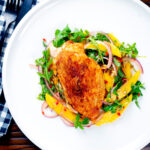 Overhead air fryer stuffed chicken breast with buffalo mozzarella cheese and jalapeno chilli peppers.
